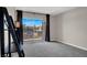 Bedroom with neutral walls, a balcony view, and carpeted flooring at 8070 W Russell Rd # 2052, Las Vegas, NV 89113