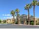 Exterior view of a well-maintained building with lush landscaping and ample parking at 8070 W Russell Rd # 2052, Las Vegas, NV 89113