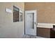 Exterior door with glass, near a window, textured wall at 8070 W Russell Rd # 2052, Las Vegas, NV 89113