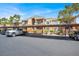Condominium building featuring covered parking, well-maintained landscaping, and neutral color scheme at 8070 W Russell Rd # 2052, Las Vegas, NV 89113