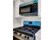 Contemporary kitchen features stainless appliances and sleek countertops at 8070 W Russell Rd # 2052, Las Vegas, NV 89113