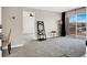Bright living room features neutral carpeting, a ceiling fan and access to a balcony at 8070 W Russell Rd # 2052, Las Vegas, NV 89113