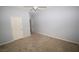Spacious bedroom with neutral walls, carpet, and multiple doors at 8084 Bosco Bay Ave, Las Vegas, NV 89113