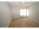 Bedroom featuring neutral walls, carpet, and a window with curtains at 8084 Bosco Bay Ave, Las Vegas, NV 89113
