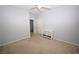 Spacious bedroom with neutral walls, carpet, and a white shelving unit at 8084 Bosco Bay Ave, Las Vegas, NV 89113