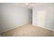 Cozy bedroom featuring neutral carpet, light gray walls and a standard door at 8084 Bosco Bay Ave, Las Vegas, NV 89113