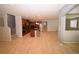 Open-concept living space showcasing the kitchen and stairs to upper level at 8084 Bosco Bay Ave, Las Vegas, NV 89113