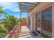 The balcony has sliding glass doors to the inside with views of palm trees at 87 E Agate Ave # 403, Las Vegas, NV 89123