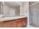 Elegant bathroom featuring double sinks and a glass-enclosed shower at 87 E Agate Ave # 403, Las Vegas, NV 89123