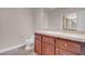 A toilet and a cabinet are featured in this bathroom at 87 E Agate Ave # 403, Las Vegas, NV 89123