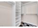 This closet has custom shelves and carpet flooring at 87 E Agate Ave # 403, Las Vegas, NV 89123