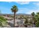 Beautiful community view featuring well-maintained homes and landscaping and mountain views in the background at 87 E Agate Ave # 403, Las Vegas, NV 89123