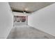 Clean, spacious garage with concrete floor and white walls, with room for multiple vehicles at 87 E Agate Ave # 403, Las Vegas, NV 89123