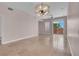 Bright, open living room with sliding glass doors to a balcony at 87 E Agate Ave # 403, Las Vegas, NV 89123