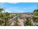 Charming neighborhood featuring well-maintained homes and landscaping and palm trees under a clear blue sky at 87 E Agate Ave # 403, Las Vegas, NV 89123