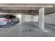 Well-lit parking garage featuring designated parking spots and clear signage at 87 E Agate Ave # 403, Las Vegas, NV 89123