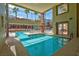 Inviting indoor pool area with large windows offering natural light and an exterior view at 87 E Agate Ave # 403, Las Vegas, NV 89123