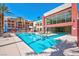 Beautiful outdoor pool area with lounge chairs and a clear blue sky at 87 E Agate Ave # 403, Las Vegas, NV 89123