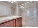 The shower features a glass door, tiled surround and modern shower head at 87 E Agate Ave # 403, Las Vegas, NV 89123