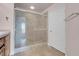 This shower features a glass enclosure and tiled surround at 87 E Agate Ave # 403, Las Vegas, NV 89123