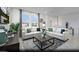Bright living room with neutral decor, large windows, and comfortable seating, creating an inviting and relaxing space at 871 Apatite Pl # Lot 54, Henderson, NV 89011