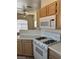 Kitchen with stove, microwave and wooden cabinets at 9000 Las Vegas Blvd # 2189, Las Vegas, NV 89123