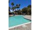 Community swimming pool surrounded by palm trees and lush landscaping at 9000 Las Vegas Blvd # 2189, Las Vegas, NV 89123