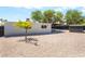 Well-maintained backyard featuring a storage shed, covered patio, and gravel for easy upkeep at 915 Melrose Dr, Las Vegas, NV 89101