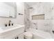 Bathroom featuring a sleek vanity, soaking tub, and rainfall shower head at 915 Melrose Dr, Las Vegas, NV 89101