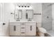 Modern bathroom with double vanity, sleek fixtures, and a tiled shower at 915 Melrose Dr, Las Vegas, NV 89101