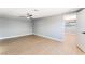Spacious bedroom with light-colored wood floors, modern ceiling fan, and neutral paint at 915 Melrose Dr, Las Vegas, NV 89101