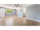 Bright bedroom with light-colored wood floors, modern ceiling fan, and ensuite bathroom at 915 Melrose Dr, Las Vegas, NV 89101