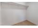 Walk-in closet featuring white walls, baseboards, and shelving for organized storage at 915 Melrose Dr, Las Vegas, NV 89101