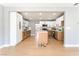 Open kitchen boasts white upper cabinets, wood lower cabinets, and a center island at 915 Melrose Dr, Las Vegas, NV 89101
