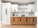Kitchen with white and wood cabinets, stainless steel appliances, and light countertops at 915 Melrose Dr, Las Vegas, NV 89101