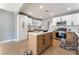 Bright kitchen with white and wood cabinets, stainless steel appliances, and a center island at 915 Melrose Dr, Las Vegas, NV 89101