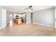 Open concept living room to the kitchen with wood flooring and neutral gray walls at 915 Melrose Dr, Las Vegas, NV 89101