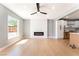 Living room showcasing an electric fireplace, large window, and light colored flooring at 915 Melrose Dr, Las Vegas, NV 89101