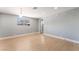 Spacious living room with recessed lights, wood-look floors, and lots of natural light at 915 Melrose Dr, Las Vegas, NV 89101