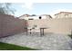 Paver patio with outdoor dining area surrounded by a block wall at 9648 Spyglass Run Ave, Las Vegas, NV 89178