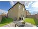 Backyard features a synthetic grass lawn, covered patio, BBQ grill, and putting green at 9648 Spyglass Run Ave, Las Vegas, NV 89178
