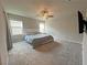Spacious bedroom features neutral carpet, fan and ensuite bathroom at 9648 Spyglass Run Ave, Las Vegas, NV 89178