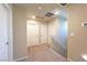 Upstairs hallway with carpet flooring and three interior doors at 9648 Spyglass Run Ave, Las Vegas, NV 89178