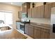 Modern kitchen with sleek gray cabinets, granite countertops, and stainless steel appliances for a stylish cooking space at 9648 Spyglass Run Ave, Las Vegas, NV 89178