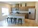 Contemporary kitchen with a large island, modern cabinets, and stainless steel appliances provides ample cooking space at 9648 Spyglass Run Ave, Las Vegas, NV 89178