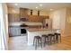Spacious kitchen featuring a central island with seating, modern cabinets, and stainless steel appliances at 9648 Spyglass Run Ave, Las Vegas, NV 89178