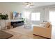 Comfortable living room features a plush sofa, modern media center, and stylish decor for relaxed living at 9648 Spyglass Run Ave, Las Vegas, NV 89178