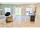 Spacious living room with tile flooring, sliding glass doors, and a ceiling fan at 9648 Spyglass Run Ave, Las Vegas, NV 89178
