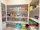 Well-organized pantry with ample shelving stocked with a variety of groceries and household supplies at 9648 Spyglass Run Ave, Las Vegas, NV 89178