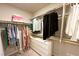 Walk-in closet featuring a combination of hanging rods and shelving for optimal organization at 9648 Spyglass Run Ave, Las Vegas, NV 89178